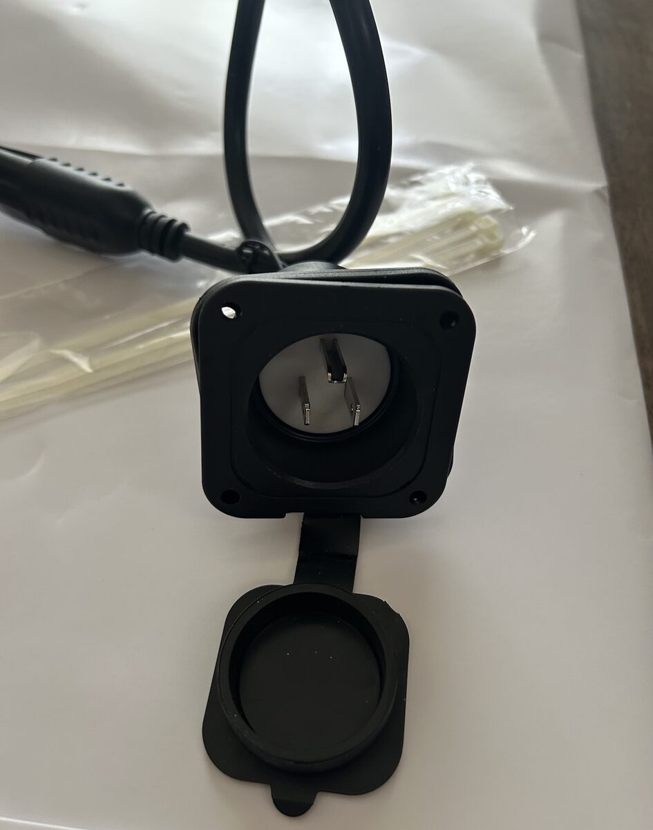 Heavy-duty 110V AC charging socket with weatherproof cap